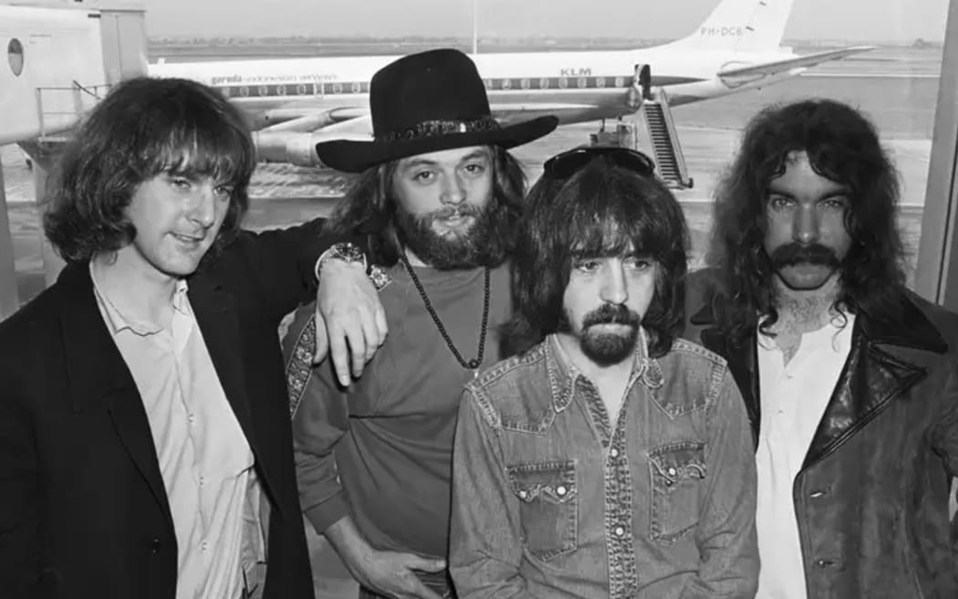A group shot of the Byrds at an airport