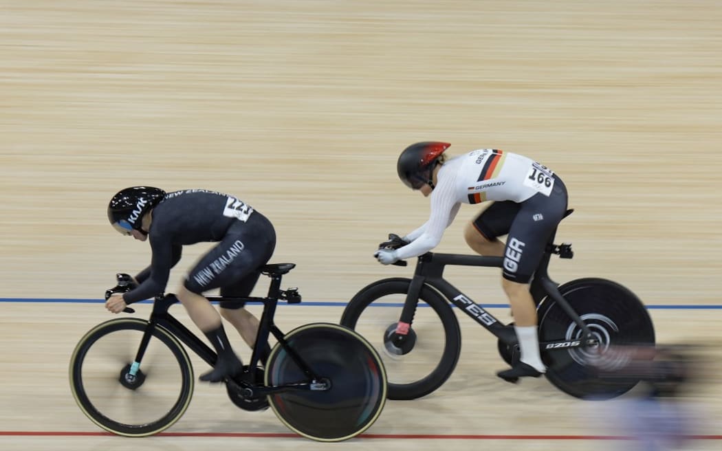 Germany's Lea Sophie Friedrich and New Zealand's Ellesse Andrews compete in the women's track cycling sprint final race 1 for gold of the Paris 2024 Olympic Games at the Saint-Quentin-en-Yvelines National Velodrome in Montigny-le-Bretonneux, south-west of Paris, on August 11, 2024. (Photo by Thomas SAMSON / AFP)