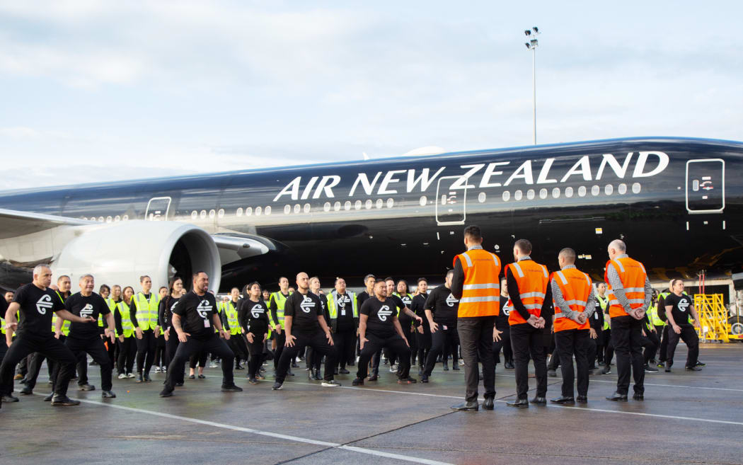 On the tarmac Air NZ staff perform a special haka for the departing All Blacks.