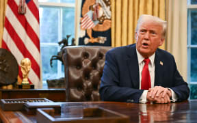 US President Donald Trump speaks to the press after signing an executive order to create a US sovereign wealth fund, in the Oval Office of the White House on February 3, 2025, in Washington, DC. (Photo by Jim WATSON / AFP)