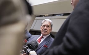Winston Peters speaks to media after emerging from the Treasury offices, as negotiations for forming a government with National and ACT continue.