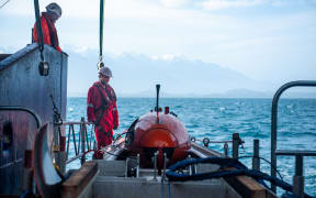 Barry Fleming (NIWA) and Mark Symons (MMT) with the Hugins AUV on board the RV Tangaroa.