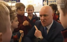 Christopher Luxon talks spelling with some schoolchildren