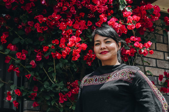 Dewi Astutipuji in her garden at her home in Hamilton.