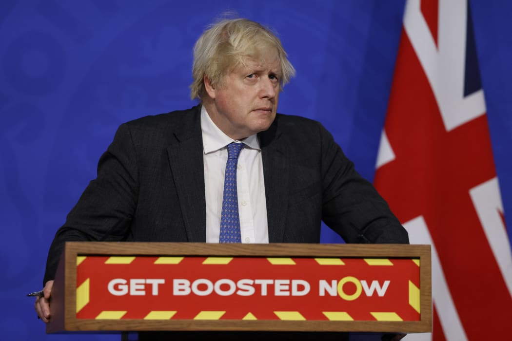 Britain's Prime Minister Boris Johnson attends a press conference to update the nation on the Covid-19 booster vaccine programme.