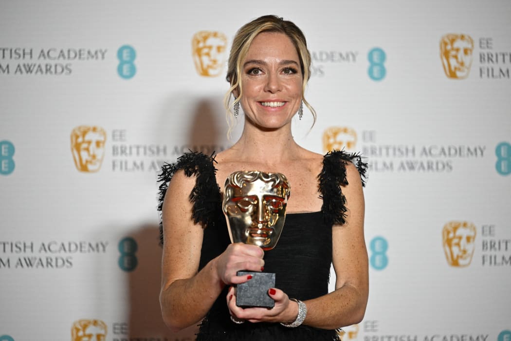 US screenwriter Sian Heder poses with the award for an Adapted Screenplay for the film 'CODA' at the BAFTA British Academy Film Awards at the Royal Albert Hall in London, on 13 March.