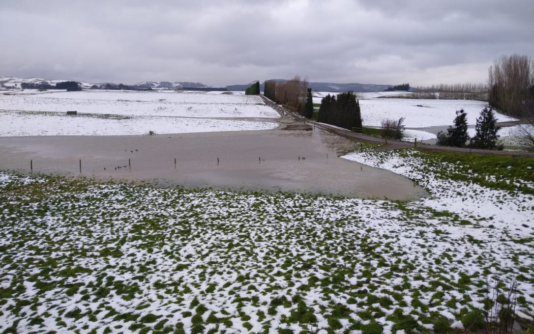 Flooding and snow at Bruce Eade's farm in Tapanui, Southland.