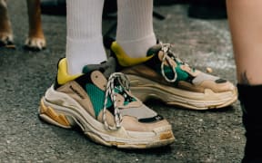 Dan Robert's says there's an 'ugly aesthetic happening. Wearing his Balenciaga sneakers (right)