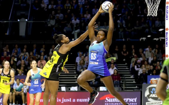 Mystics' Grace Nweke takes a pass with Pulse's Kelera Nawai defending.