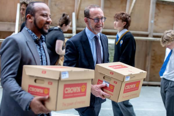 Rongotai College is back to help Wellington Library move books back in