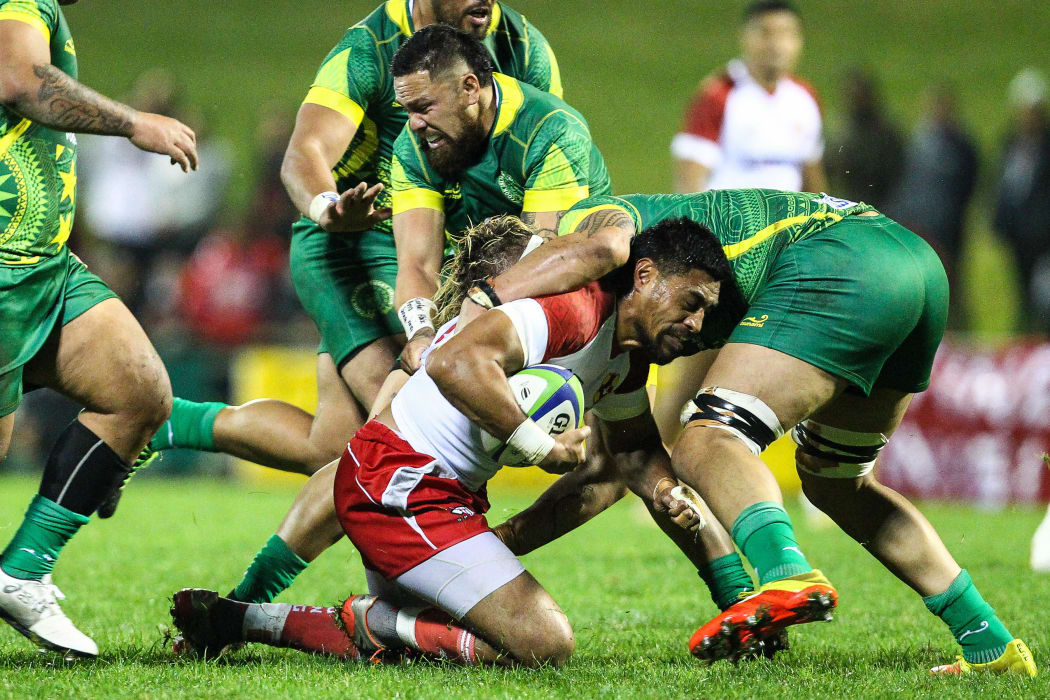 Tonga's Sam Vaka is tackled during their Rugby World Cup qualification match against the Cook Islands in July.