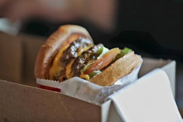 Hundreds of people have lined up for a taste of US burger joint In-N-Out at a pop-up in Auckland.