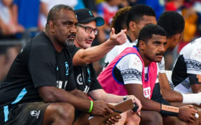 Fiji coach Ben Gollings (2L) gestures during the HSBC Rugby Sevens semi-final cup match between Fiji and New Zealand in Singapore on April 9, 2023. (Photo by Roslan RAHMAN / AFP)