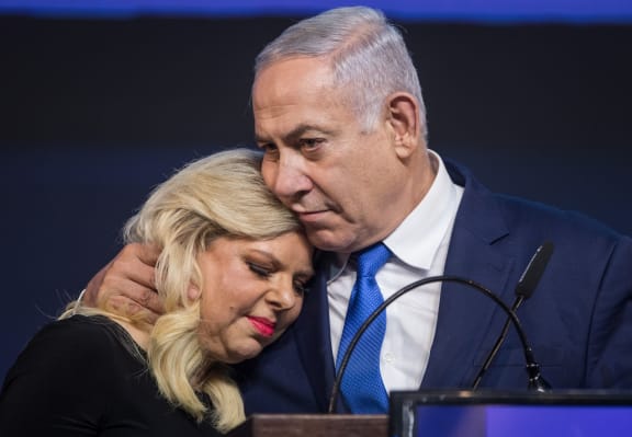 10 April 2019, Israel, Tel Aviv: Benjamin Netanyahu, Prime Minister of Israel, embraces his wife Sara at a post-election event.