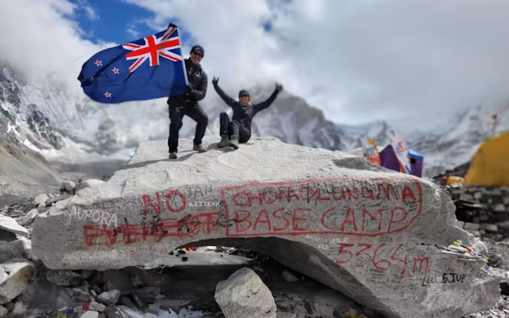 Author Heike Schanzel (right) atop the famous and much-photographed base camp rock.