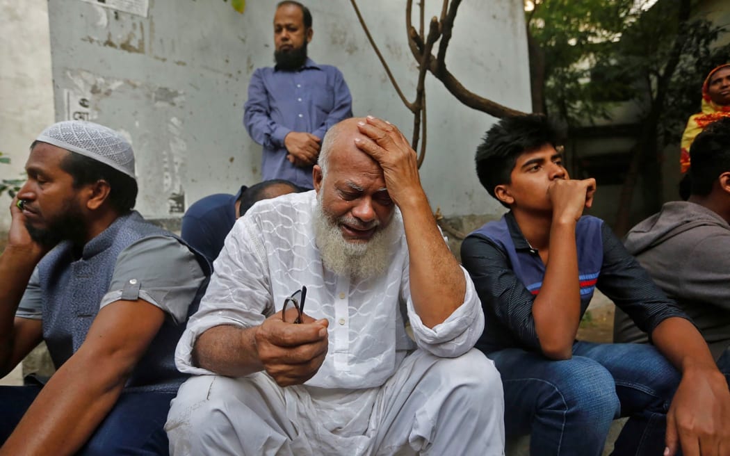 A relative of victims who were killed in a fire mourns in Dhaka on February 21, 2019.