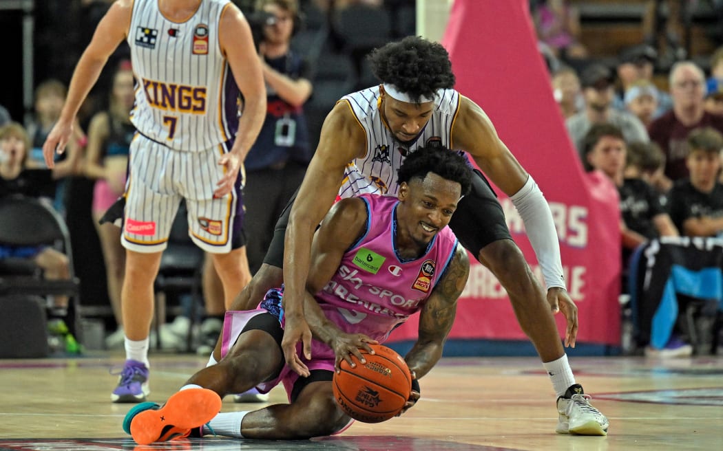 Justin Simon of the Sydney Kings and Barry Brown Jr of the NZ Breakers contest possession in game two of their NBL final series.