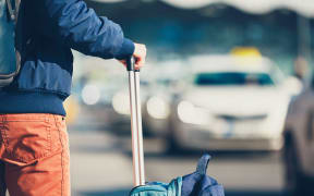 A passenger waiting for a taxi.