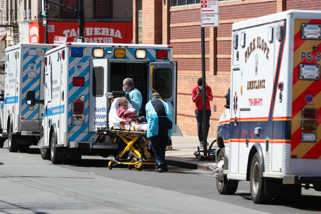 NEW YORK, USA - APRIL 06: Healthcare workers are helping a patient at the Wyckoff Heights Medical Center in Brooklyn, New York City, United States on April 6, 2020.