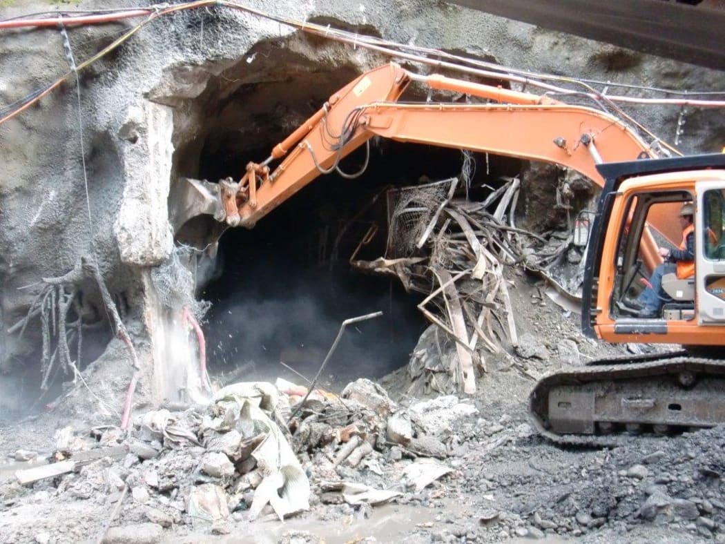Heavy equipment clearing debris from the Pike River mine portal.