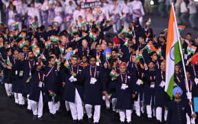 Athletes for Team India take part in the opening ceremony for the Commonwealth Games at the Alexander Stadium in Birmingham, central England, on July 28, 2022. (Photo by Glyn KIRK / AFP)
