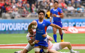 Gordon Langkilde is tackled during the Vancouver Sevens in March.