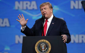 US President Donald Trump speaks at the National Rifle Association Institute for Legislative Action Leadership Forum in Lucas Oil Stadium in Indianapolis.