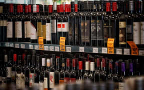 Bottles of wine on a shelf at a supermarket in Australia.