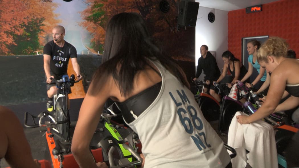 Carol Hirschfeld takes part in a HIIT class/