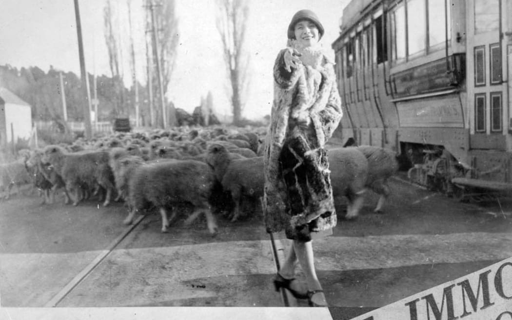 The legendary Russian ballerina Anna Pavlova poses with a flock of sheep during her visit to New Zealand in 1926.