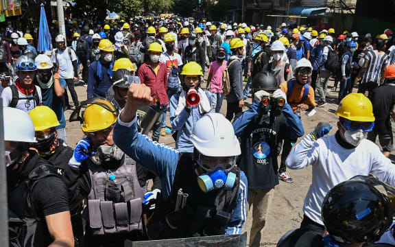 Protesters wearing protective gear take part in a demonstration against the military coup in Yangon over the weekend.