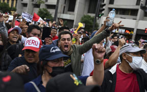 Supporters of Peru's former President Pedro Castillo protest demanding his release and the closure of the congress in Lima on 11 December, 2022.