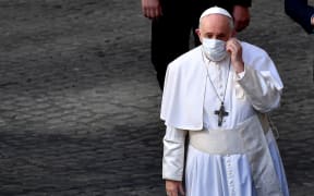 Pope Francis arrives to hold the weekly general audience, at San Damaso courtyard in The Vatican, on June 30, 2021.