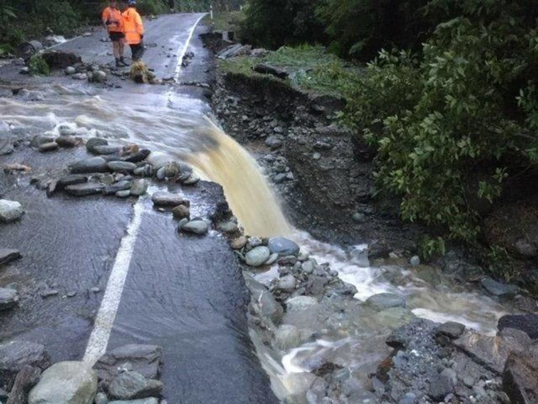 The slip has caused large trees, soil, rocks and streams to cut across the highway.