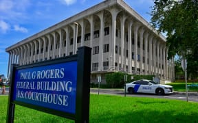 A view of the Paul G. Rogers Federal Building and US Courthouse during a hearing on the detention of Ryan Wesley Routh, suspected of the attempted assassination of former US president Donald Trump, in West Palm Beach, Florida, on September 30, 2024. Ryan Wesley Routh, 58, was charged with possession of a firearm as a convicted felon and possession of a firearm with an obliterated serial number at his initial court appearance. (Photo by Giorgio VIERA / AFP)