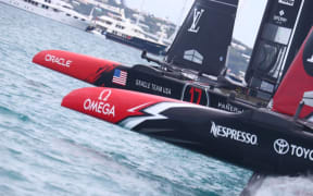 Oracle Team USA and Emirates Team New Zealand during race six.