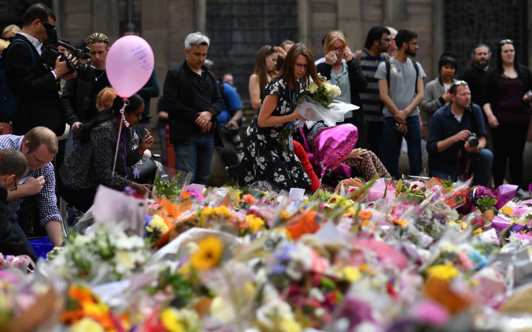 People lay flowers in Manchester after the attack.