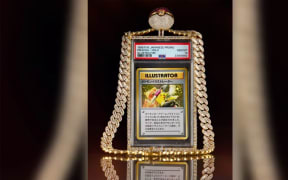 The Pikachu Illustrator card was auctioned along with the custom diamond necklace Logan Paul famously wore at WrestleMania38.
