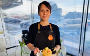 Auckland's GF Depot owner and chef Vivi Cheung with a gluten free muffin.