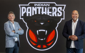 Sky's Justin Nelson, left, and InBL Pro chief executive Parveen Batish show the Indian Panthers logo.