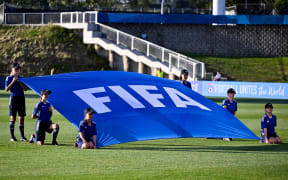 FIFA flag and flag bearers.