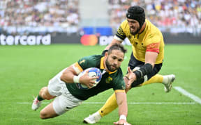 Cobus Reinach of South Africa scores against Romania at Nouveau Stade de Bordeaux.