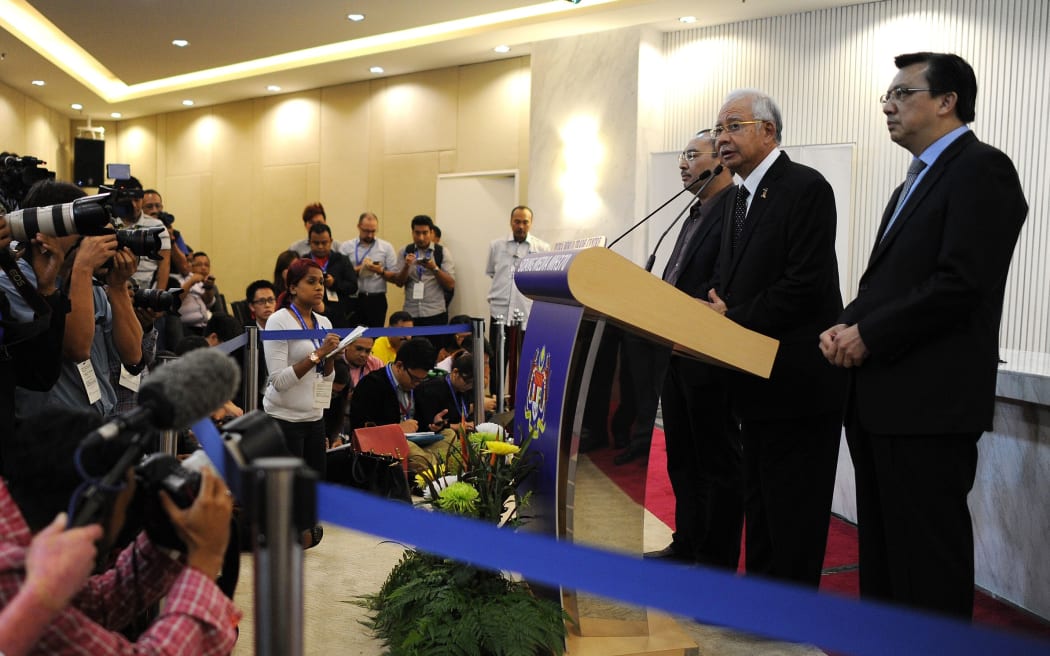 Malaysia's Prime Minister Najib Razak and Transport Minister Liow Tiong Lai delivering the statement on the missing Malaysia Airlines flight MH370.