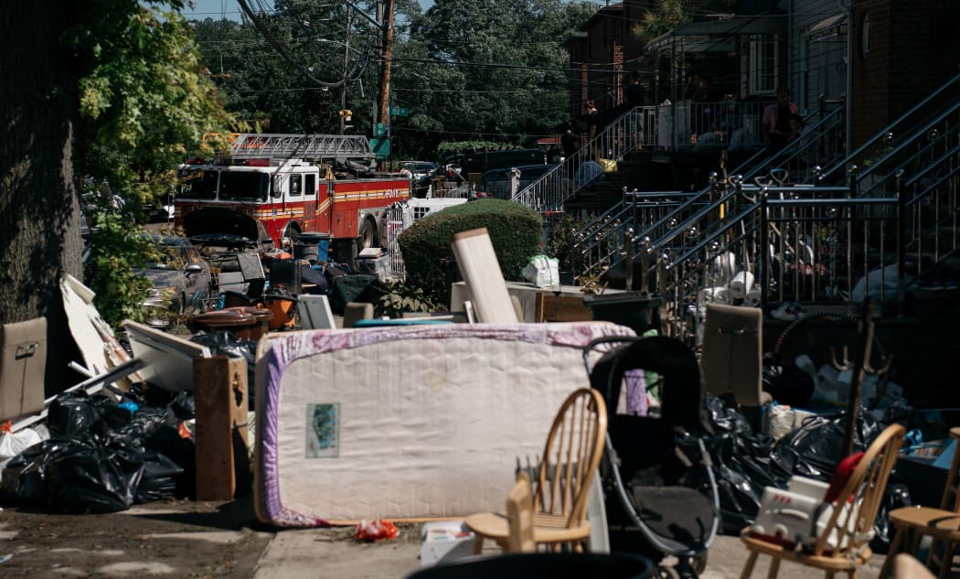 NEW YORK, NY - SEPTEMBER 2: Residents sort through damaged and destroyed items after a night of heavy rain and wind caused many homes to flood on September 2, 2021 in the Flushing neighborhood of the Queens borough of New York City.
