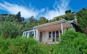 A red stickered home in Nelson, in October 2022, following major floods in the region in August.