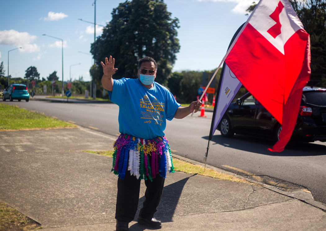The Tongan flag is waved out the front of the Tokaikolo ‘Ia Kalaisi church in Māngere Bridge.