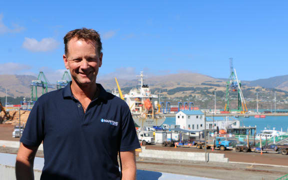 Maritime NZ's Principal Advisor Recreational Craft, Matt Wood, pictured in front of the SailGP finish line in Whakaraupō Lyttelton Harbour.