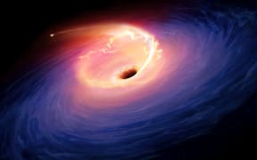 Artwork depicting a tidal disruption event (TDE). TDEs are causes when a star passes close to a supermassive black hole and get torn apart by the gravity of the latter. The debris forms a fan-shaped pattern around the black hole before eventually falling in. (Photo by MGA / Science Photo Library via AFP)
