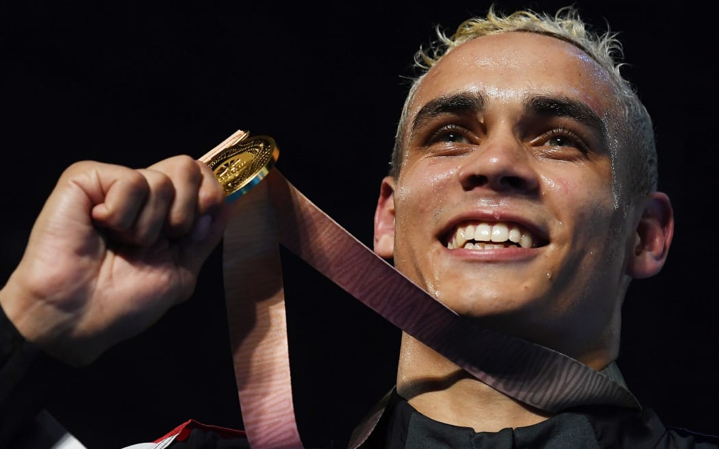 David Nyika with his gold medal after winning the Men's Heavy 91kg boxing final on the Gold Coast.