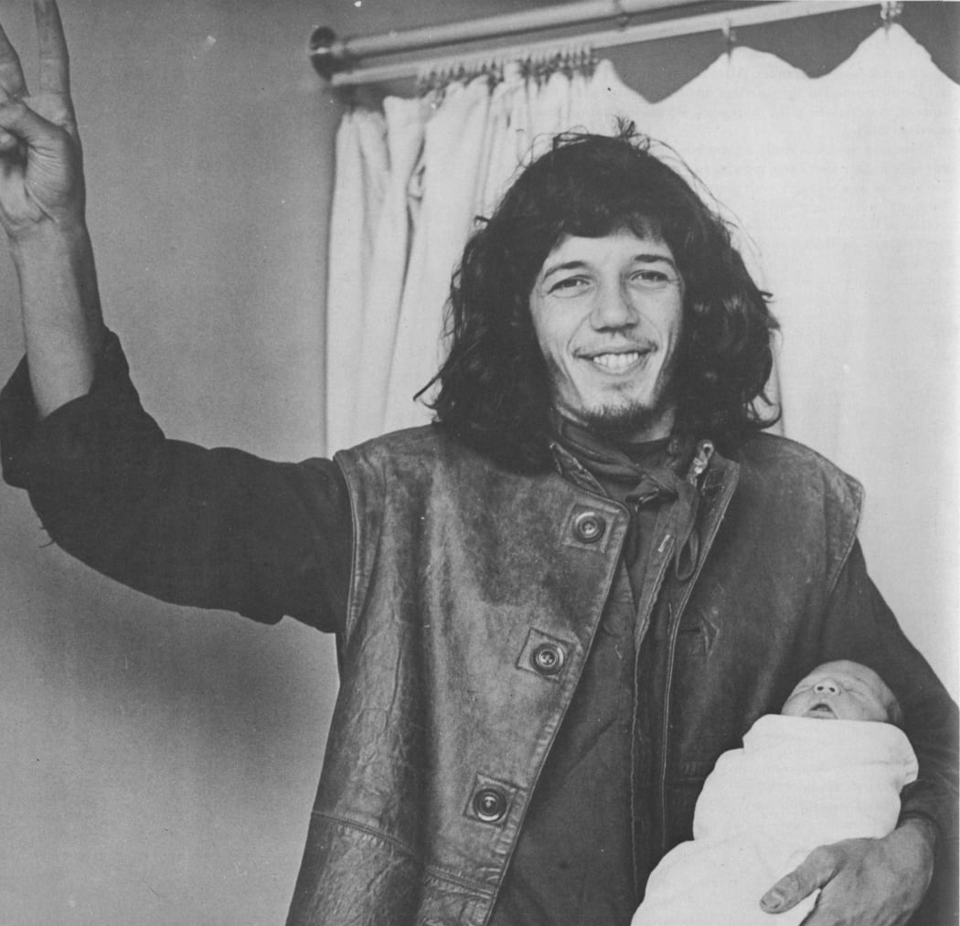 Tim Shadbolt with son Reuben in 1971 photograph taken from the book "Bullshit and Jellybeans."